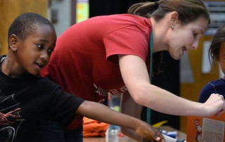 Volunteer reading to children