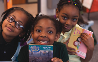 Girls smiling with books