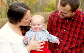 Parents and their baby who has a cleft palate