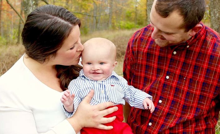 Parents and their baby who has a cleft palate